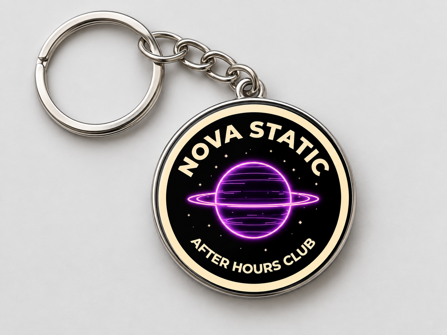 Band keychain featuring a purple planet design